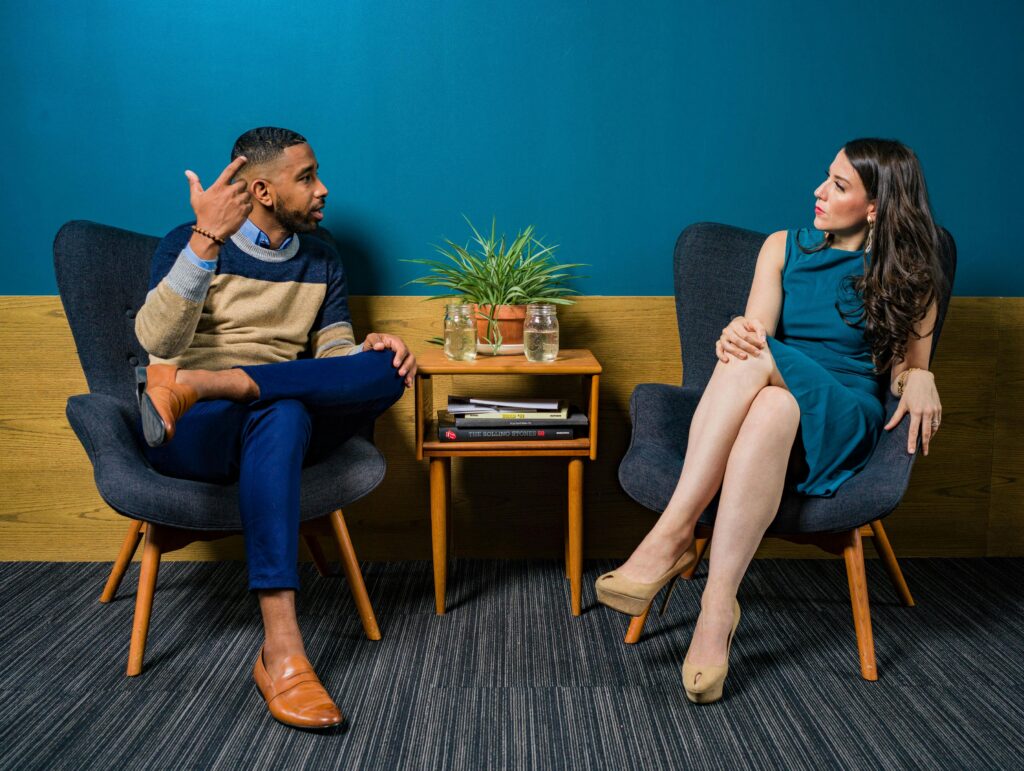 man and woman communicating using communication skills